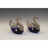 Pair of Continental white metal and blue glass swan-form salts, each stamped 800, with pierced