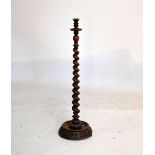 Turned walnut smokers companion, having barley twist column on turned carved base, 95cm high