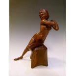Art Deco-style carved wooden figure of a seated naked female, incised initials CB or BC to stool,