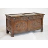 17th Century carved oak coffer with hinged panelled cover over lunette-carved frieze and two