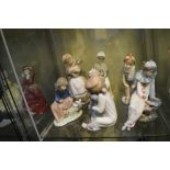 Group of Nao porcelain figures of children, tallest 22cm high (7)