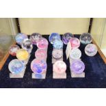 Quantity of Caithness glass paperweights to include; Moonflower, Fountain and Mosaic, some with