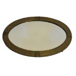 Arts & Crafts style oval brass metal hammered finish framed mirror, 79cm x 54cm overall, together