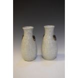 Pair of Oriental celadon crackle glaze vases, having lion mask and ring handles, marks to base, 22cm