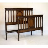 1920's carved oak double bedhead and foot, 141cm wide, the headboard 134cm high