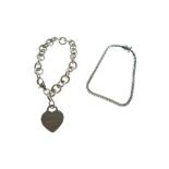 Silver belcher-link charm bracelet with heart shaped charm stating 'Please Return to Tiffany & Co