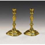 Pair of 18th Century brass candlesticks with seamed socket on octagonal base, 18.5cm high (2)