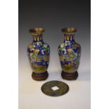 Pair of cloisonné baluster shaped vases decorated with exotic birds and foliage against a blue