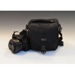 Leica digital camera with 25/400mm zoom lens and SD card in camera bag