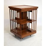 Early 20th Century mahogany square top revolving book table, 53.5cm x 81cm high