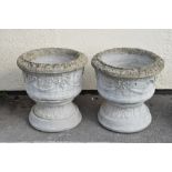 Large pair of modern garden planters of circular form with ribbon and swag decoration, 57cm diameter