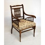 Edwardian mahogany elbow chair having pierced lattice back and scroll arms raised on turned supports