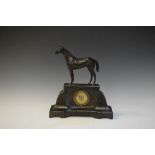 Early 20th Century mantel timepiece with Arabic dial, the case surmounted by a standing racehorse,