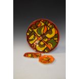 Poole pottery Delphis range charger, 35cm diameter and two smaller similar dishes