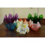 Nine handkerchief design glass bowls, some having printed decoration, the larger standing 17cm high,