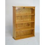 Varnished pine open bookcase, fitted three shelves, 85cm wide