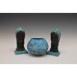 Pair of turquoise glazed pottery bookends formed as stylised female heads, together with a similarly