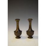 Pair of early 20th Century Japanese bronze vases of caster form with panel decoration, 16cm high