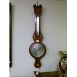 19th Century mahogany and string inlaid wheel barometer, (with alcohol thermometer), the silvered
