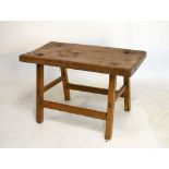 Rustic rectangular table raised on four splayed supports, 80cm wide