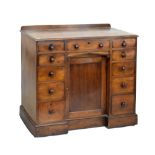 Victorian mahogany kneehole dressing table fitted eleven drawers, with cupboard on plinth base, 90cm
