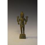 Indian brass alloy or bronze figure of a four-armed deity in standing pose on box base, 17cm high