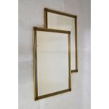 Pair of rectangular gilt framed bevelled glass mirrors, 58cm x 89cm