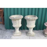 Pair of reconstituted garden urns of campana form, 43cm diameter x 66cm high