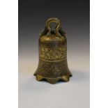 Chinese Archaisitc-style polished bronze bell with zoomorphic loop handle over panels of flowers,