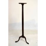 Mahogany fluted torchère stand on tripod base, 128cm high