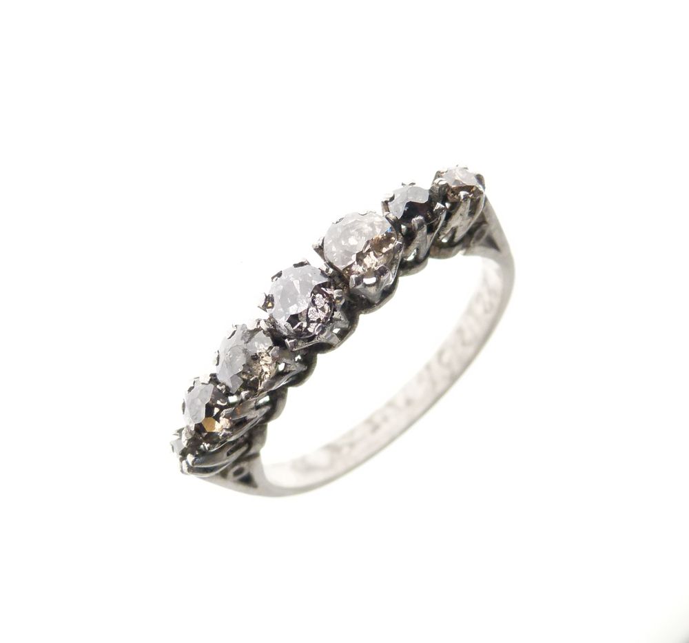 Mid 20th Century platinum and seven-stone diamond ring, of graduated stones, shank stamped Plat,