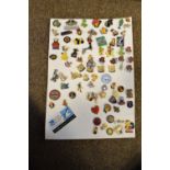 Large collection of enamel pins and badges