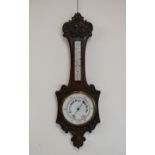Late 19th/early 20th Century oak wheel barometer having mercury thermometer with ceramic register