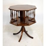 Early 20th Century mahogany and string inlaid octagonal revolving book table on four splayed feet,