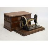 Walnut cased Singer sewing machine