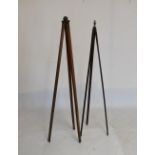 Two vintage tripods, the taller standing 143cm high when closed