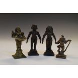 Four small Indian bronze figures, one holding a dish as votive oil lamp, largest 8.5cm high (4)