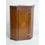 George III mahogany and string inlaid wall hanging corner cupboard having marquetry panel of