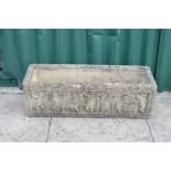 Reconstituted rectangular trough, the front with relief frieze of putti, 79cm wide