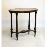 Victorian walnut and ebonised oval occasional table raised on fluted supports united by x-frame