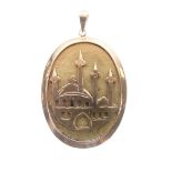Unmarked yellow metal Middle Eastern (possibly Turkish) oval pendant with a view of a mosque,