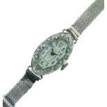 Lady's platinum and white sapphire dress or cocktail watch, with silvered oval Arabic dial, unmarked