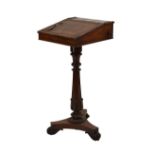 Rosewood pedestal writing table, the hinged fall with blind-tooled skiver, one side with hinged