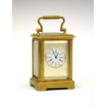Early 20th Century brass-cased 'Mignonette' carriage clock, the 2cm diameter circular dial with blue