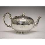 Victorian silver bullet shaped teapot on a moulded foot engraved with foliate scrolls, melon