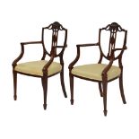 Pair of Edwardian Hepplewhite Revival open armchairs, probably in mahogany-stained beech, each