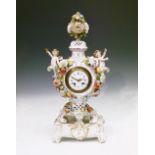 Late 19th/early 20th Century Continental porcelain mantel clock, of vase form surmounted by '