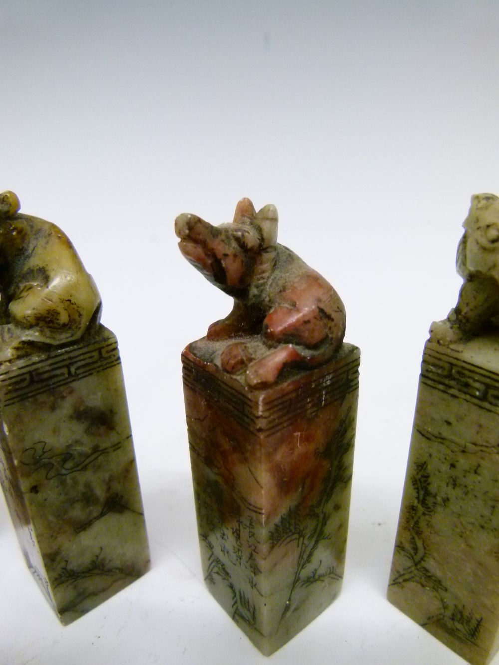 Set of twelve Chinese soapstone desk seals, each surmounted by a differing animal symbolising the - Image 8 of 14