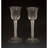 Pair of air twist cordial glasses, each with inverted bell shaped bowl on plain foot, 14.5cm high (