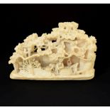 Japanese Meiji period carved ivory okimono, depicting figures outside a thatched mill cottage
